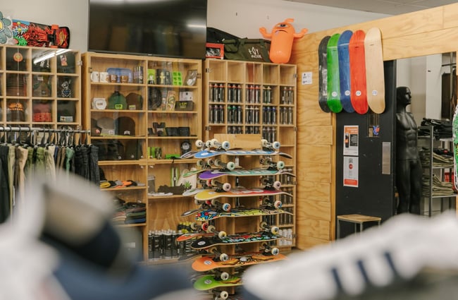 Skateboards, skateboard decks, spray paint cans and more on display inside Embassy.