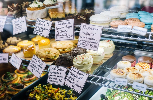 Cabinet filled with sweet treats and salads at Emmalou Macaron & Coffee, New Plymouth.