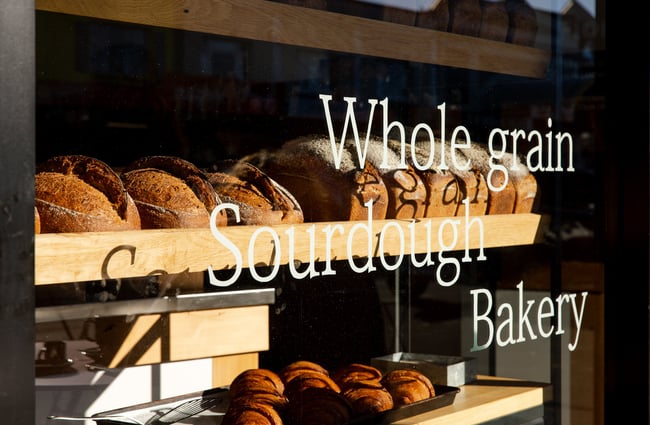 Window signage promoting sour dough.
