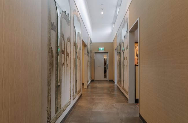 A dimly lit hallway inside Flow Wellbeing.