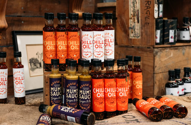Close up of bottles of chilli oil and hot sauces
