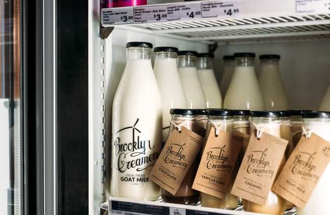 Close up of fresh organic milk in the fridge at deli