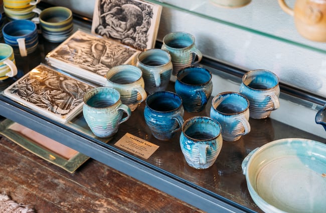 A close up of blue ceramic cups.