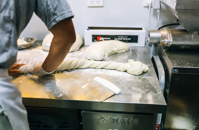 Rolling noodles in the kitchen at Garden Place Noodle Bar, Hamilton.