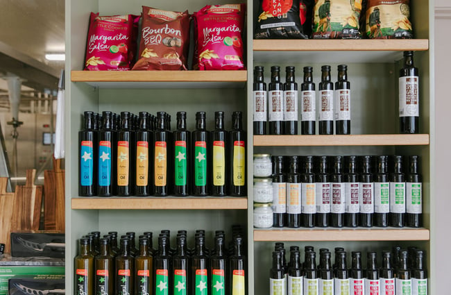 Shelves of different oils for sale at Geraldine Cheese Company.