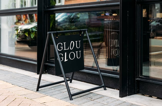 Black Glou Glou sign outside of cafe at Wellington's The Exchange Building