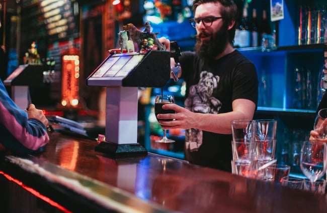 A man pouring beer.