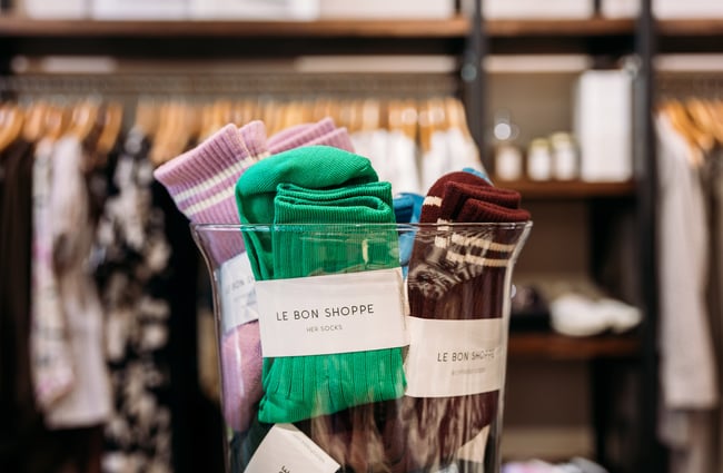 Close up of Le Bon Shoppe socks in a jar in clothing store