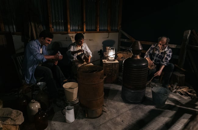 An exhibition of mannequins making moonshine.
