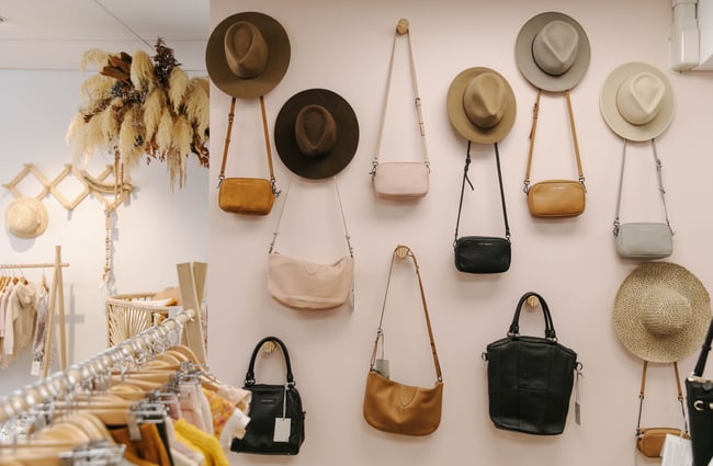 Wall display of hats and bags.