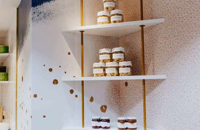 Shelves of caramels in jars at J’aime les macarons in Christchurch.