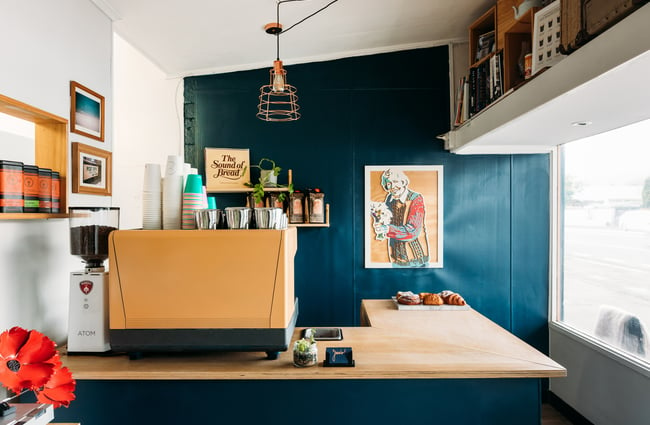A view of the small counter and coffee machine in Jeans Upper Hutt.