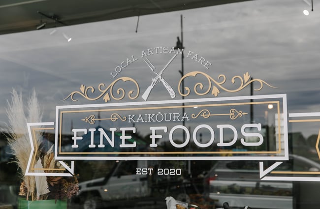 Kaikōura Fine Foods sign in the window.