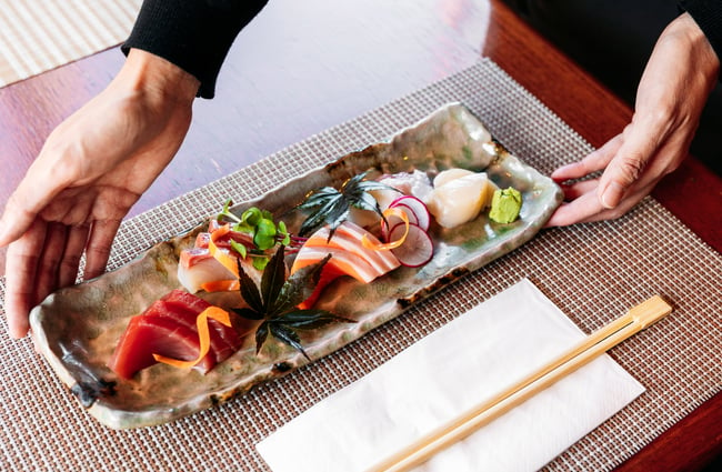A plate of fresh Japanese food on a plate.