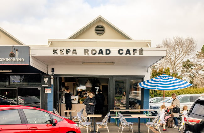 The white and blue exterior of Kepa Road Cafe.