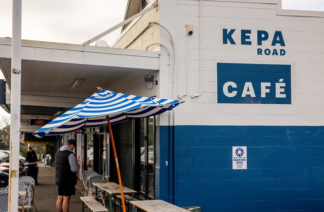 The blue and white exterior of Kepa Road Cafe.