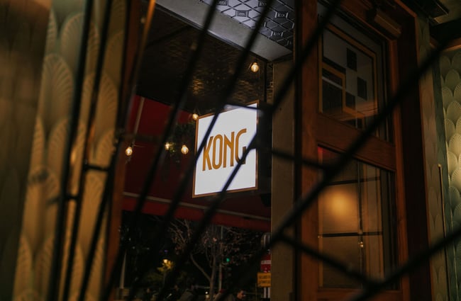 Close up of Kong sign from the outside of art deco bar in Christchurch at nighttime
