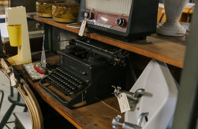 Old typewriter and radio on shelves at La Voute, Christchurch.