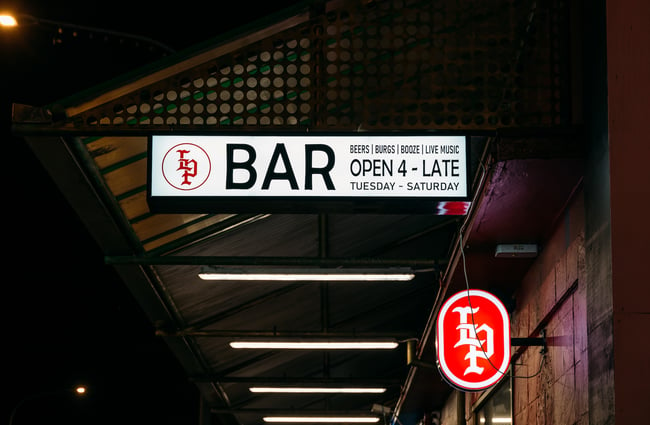 Illuminated signs at the exterior of Last Place Bar