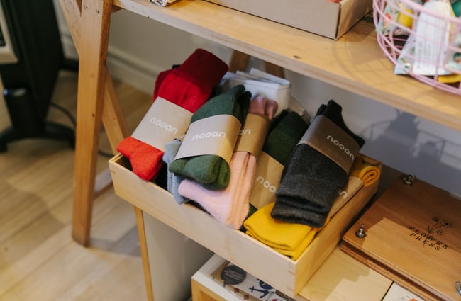 Box of colourful socks at Little Beehive Co-op.