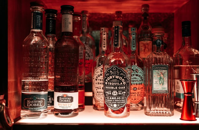 A close up of liquor bottles.