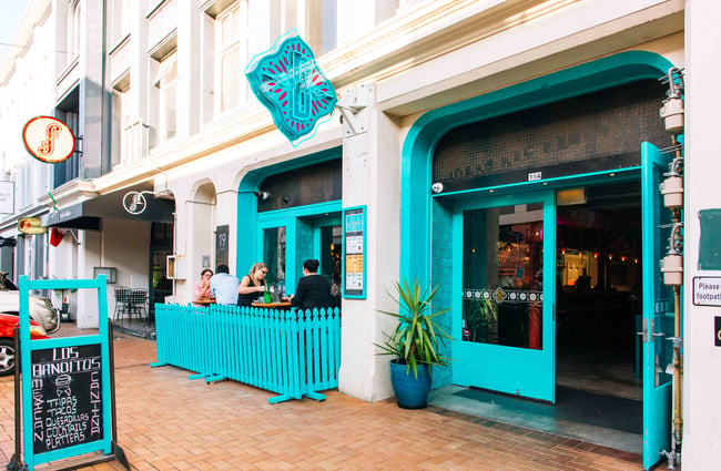 Turquoise exterior of Blair St restaurant.