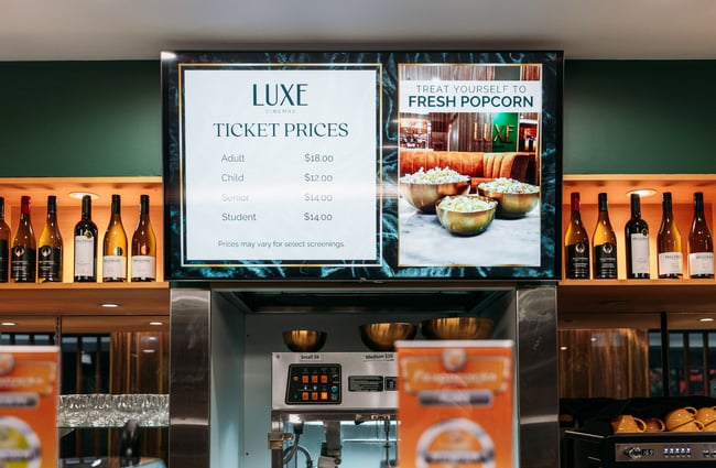 Ticket prices menu behind the counter at Luxe cinemas.