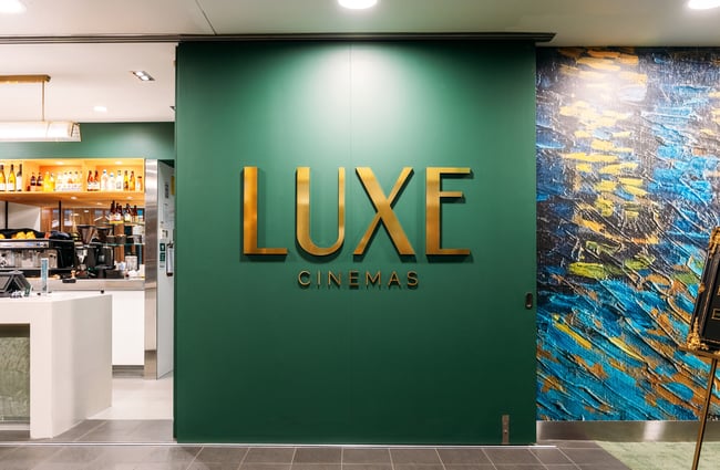 Close up of 'Luxe Cinemas' sign.