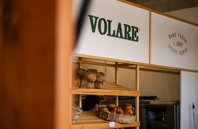 A close up of a sign that says 'volare'.