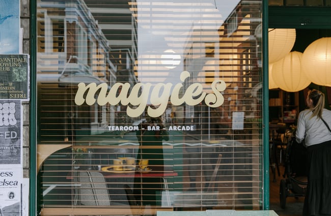 A 'Maggies' sign on the cafe window.