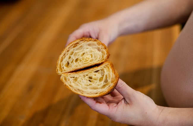 A close up of the inside of a croissant.