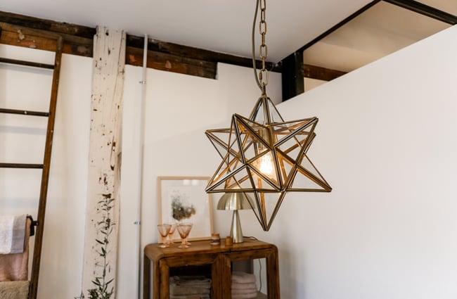 A star lampshade hanging from the ceiling.