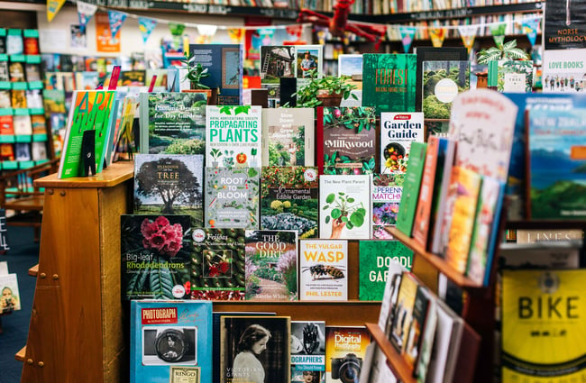 Plant books on shelves.