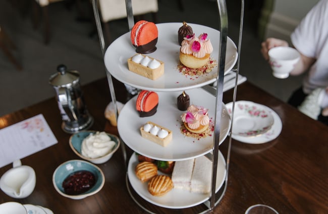 Teared tray of colourful high tea foods at Mona Vale in Christchurch.