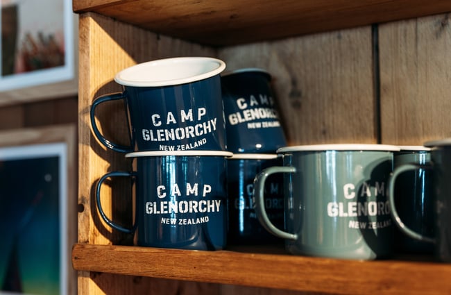 A close up of mugs that say Camp Glenorchy.