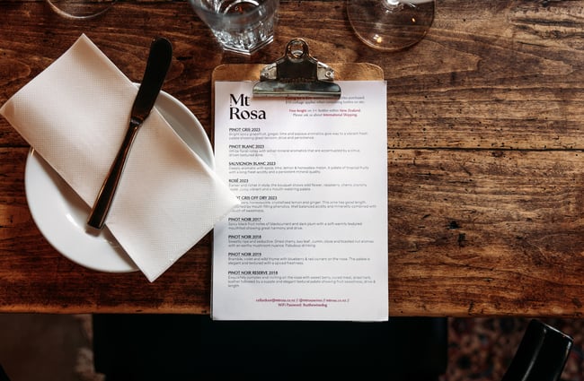 A black and white Mt Rosa menu on a table.
