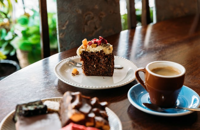 Cake and coffee on a table at Munch in Palmerston North.