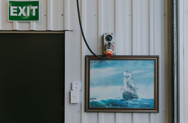 Painting of a vintage sail boat on the wall at Noisy Brewing Company, Dunedin.