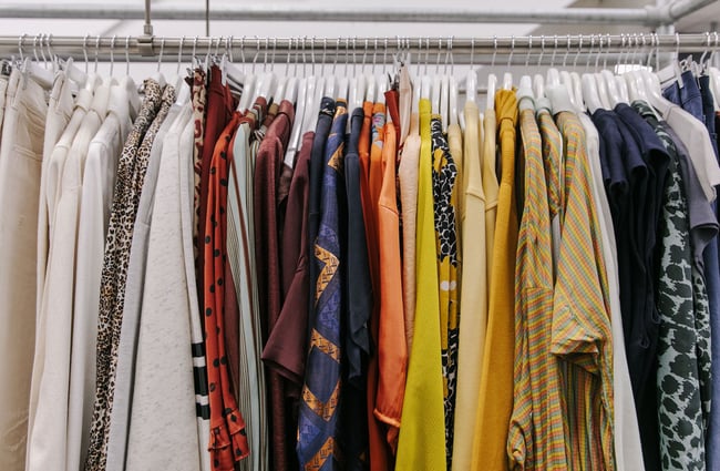 Close up of colour coordinated clothing rack.