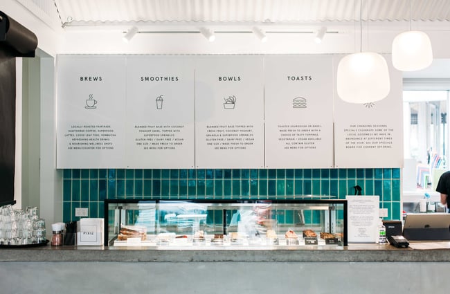 A close up of the blue and white counter and wall menu