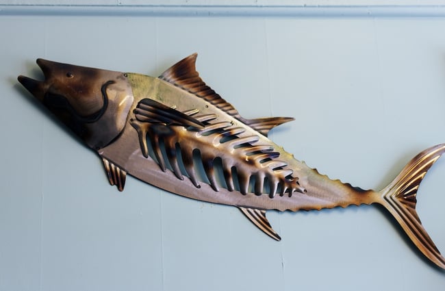 Metal fish scultpure on the wall inside Plimmerton Fish Supply.