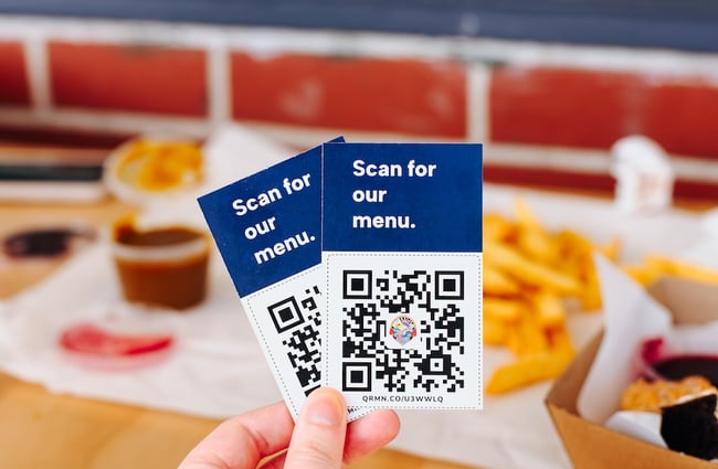 Little paper slips with QR codes to access Plimmerton Fish Supply's menu.