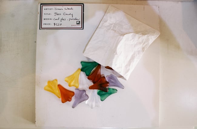 Colourful glass jet planes, falling out of paper bags.