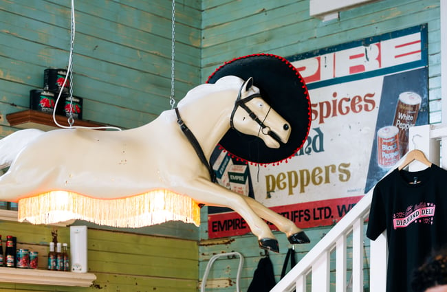 A horse lamp hanging from the ceiling at Queen Sally's Diamond Deli and cafe Wellington.