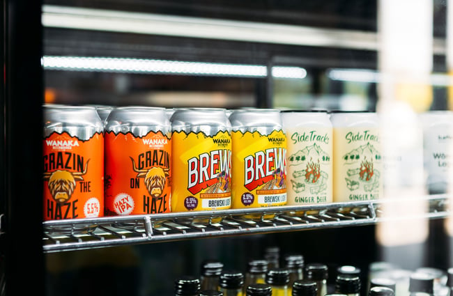 Close up of colourful cans of beer in the fridge at Red Star, Wānaka.