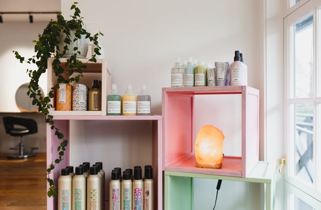 Pastel shelves and products at Refuge Hair Boutique, Wellington.