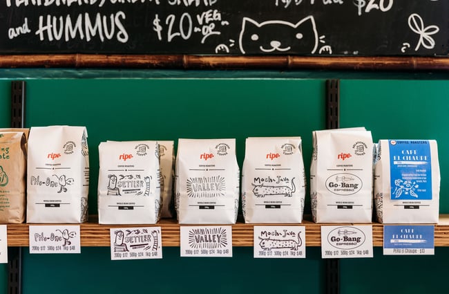 Bags of coffee on cafe shelf