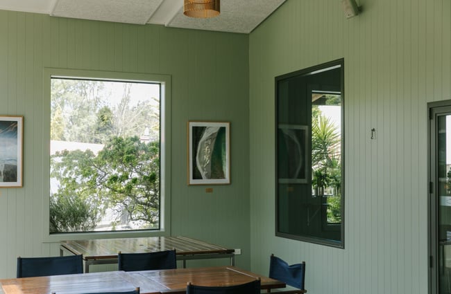 Inside the Riverstone Kitchen restaurant with the sage green covered walls.