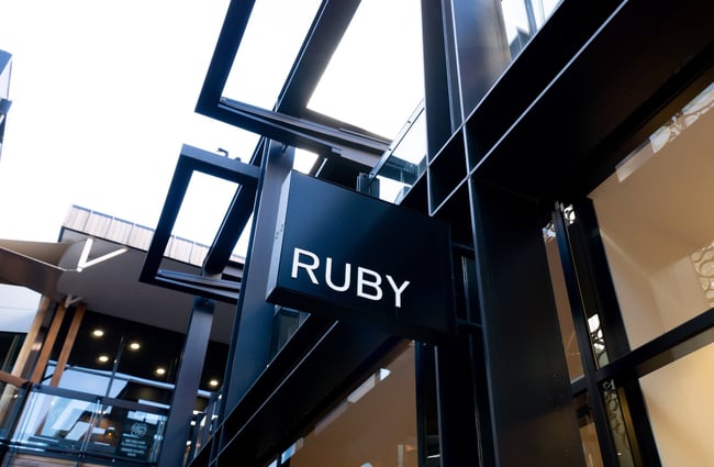 The black exterior overhead sign outside Ruby in central Christchurch.
