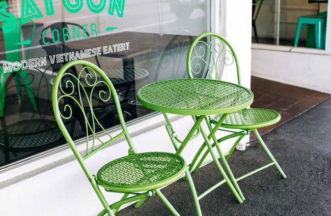 Close up of green outdoor chairs.